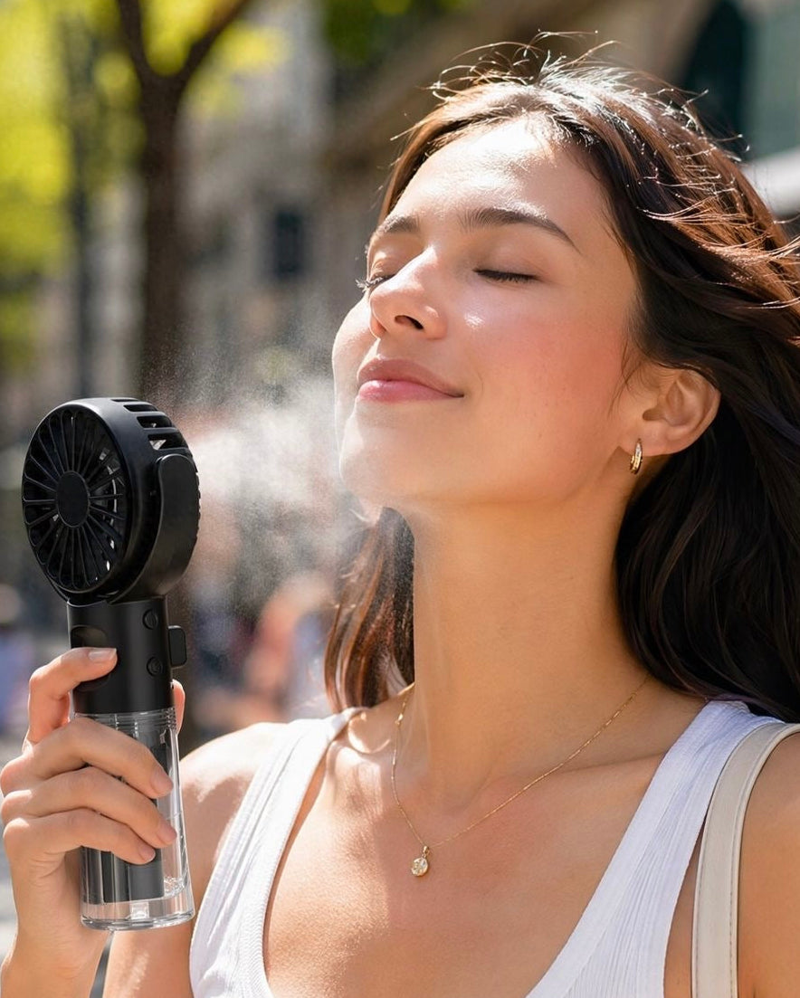 Woman using a handheld fan on a sunny street