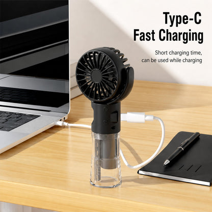 Black handheld fan on a desk with a laptop and notebook, featuring Type-C fast charging text.